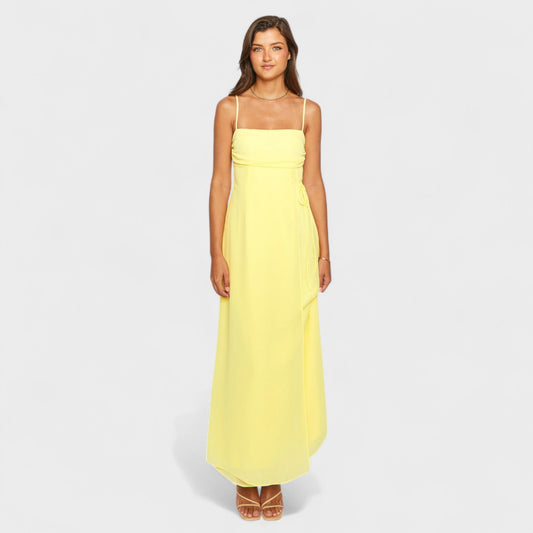 Flossie – Vestido Maxi Amarillo con Lazo Lateral