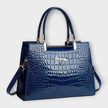 Rita. – Bolso de mano efecto cocodrilo brillante Rita. – Bolso de mano efecto cocodrilo brillante Rita Blau 